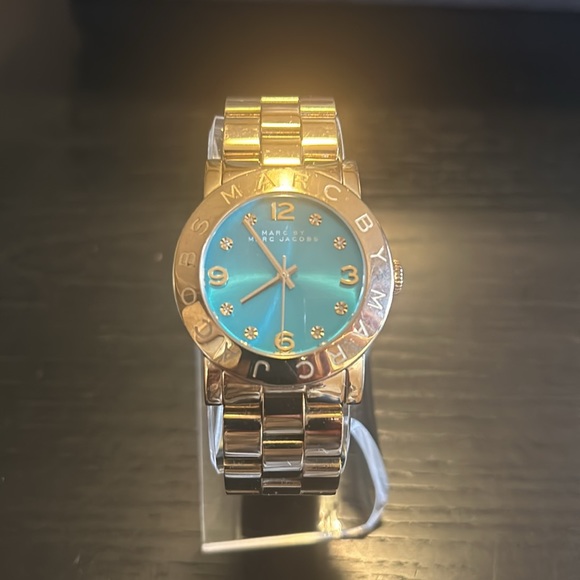 Marc by Marc Jacob’s stainless steel gold tone watch, accented w/ gold crystals. - Picture 1 of 8